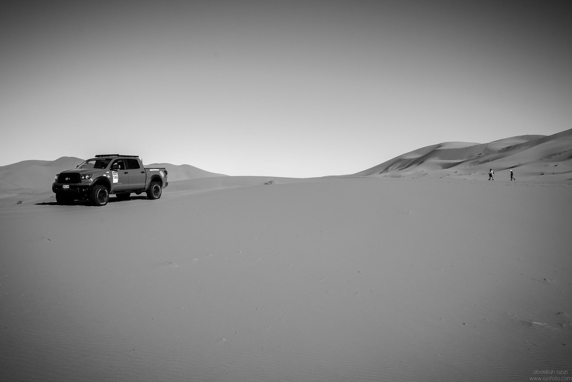 SUV truck in Sand dunes, Black and White Photo