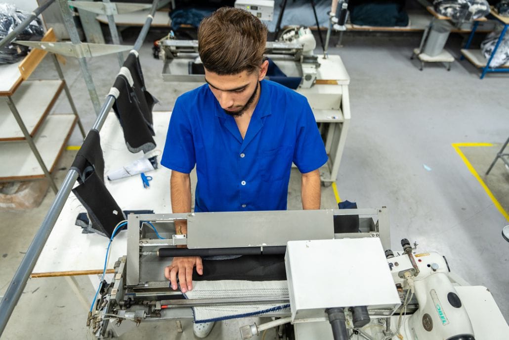Working young man - tailoring factory